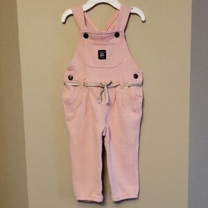 Baby B'gosh soft pink overalls with a gold tie